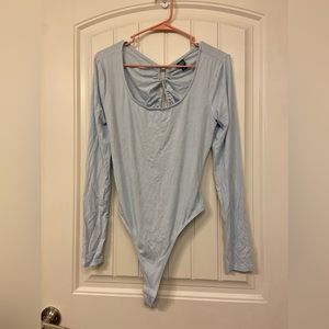 Cross back open body suit